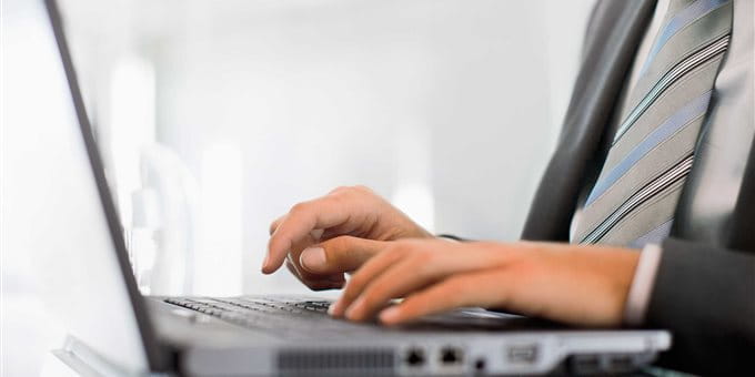 A person is typing on a laptop. A person is typing on a laptop.