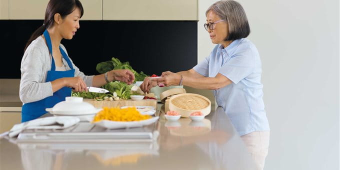 Two women are preparing a meal Two women are preparing a meal