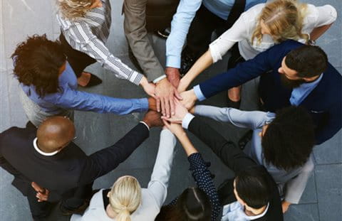 A team stands in a circle A team stands in a circle