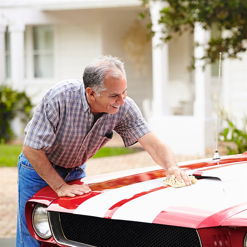 Man cleans classic car Man cleans classic car