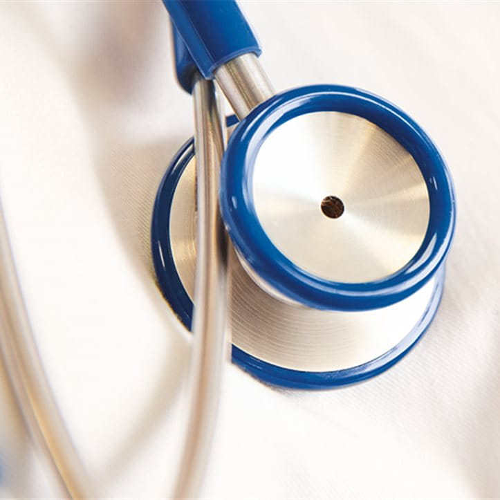 A blue stethoscope on a white background. A blue stethoscope on a white background.