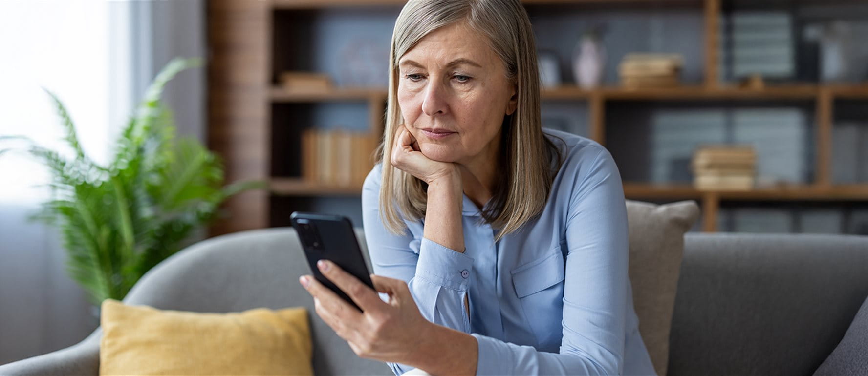 Woman looking at her cell phone Woman looking at her cell phone