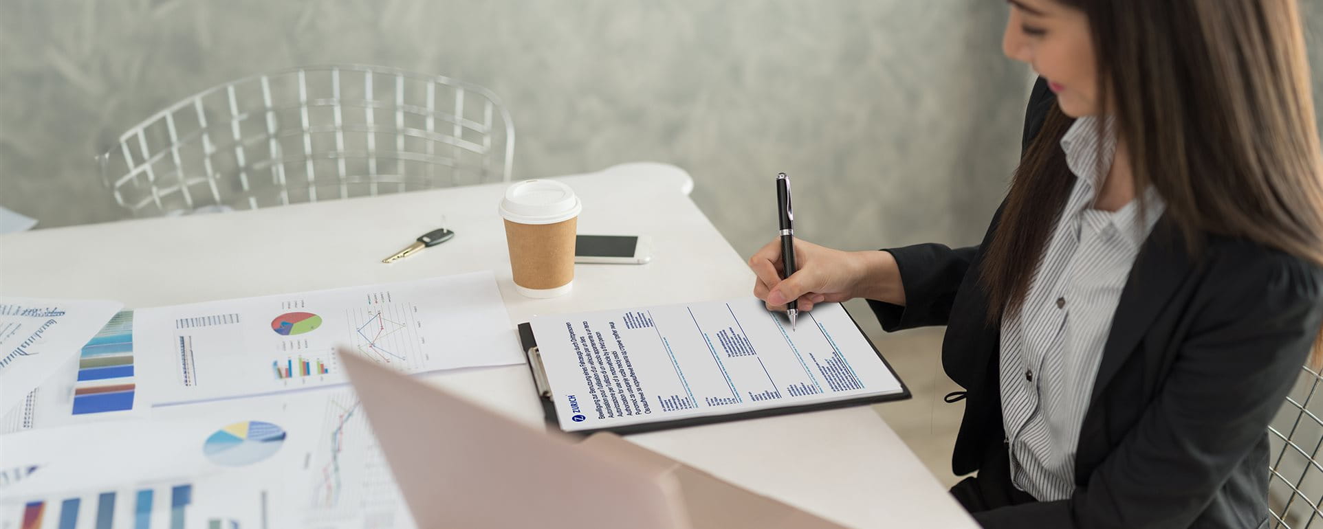 A woman fills out a form A woman fills out a form