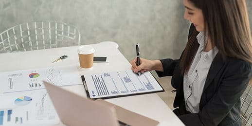 A woman fills out a form