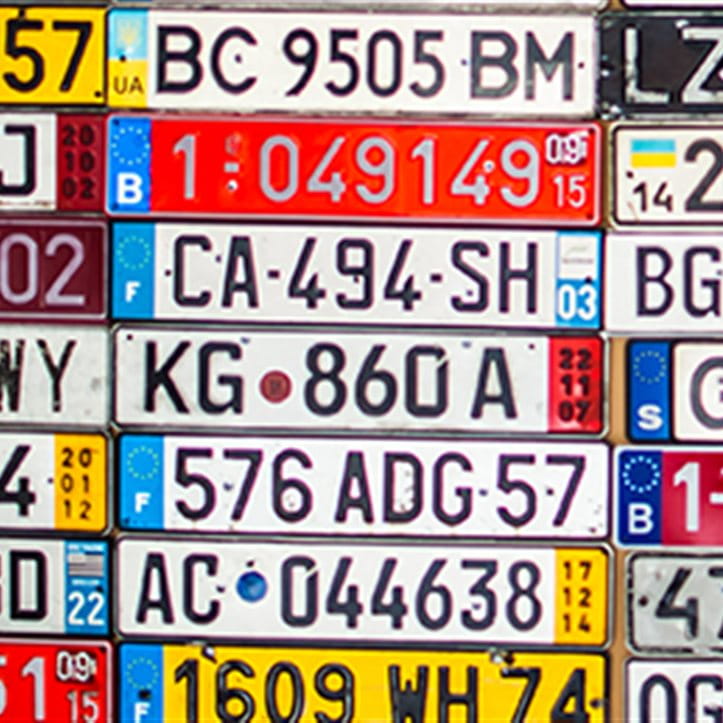 Many different license plates attached to one surface Many different license plates attached to one surface