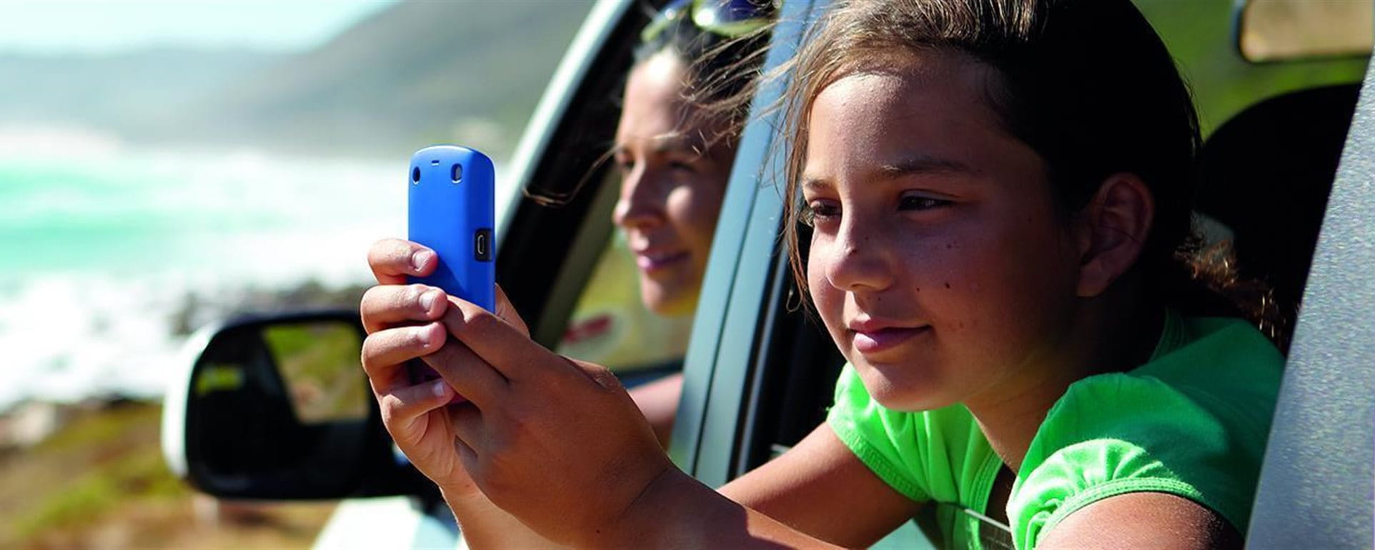 Child with cell phone in the car Child with cell phone in the car