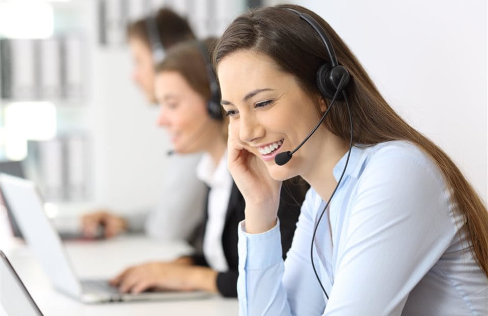 Woman with a headset in a call center Woman with a headset in a call center
