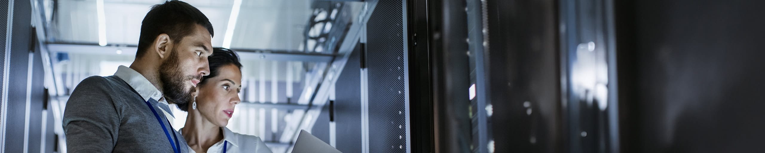 Two employees in the server room