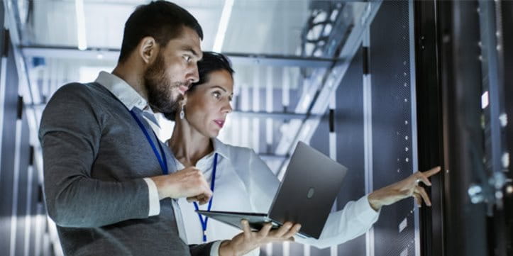 Two employees in the server room Two employees in the server room