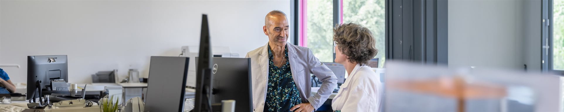 Woman and man are talking in a laboratory  Woman and man are talking in a laboratory