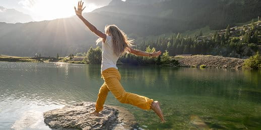  woman enjoys the lake shore