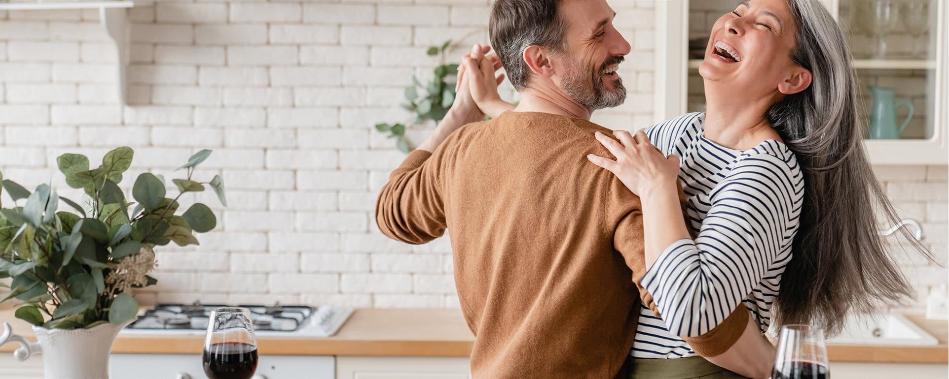Couple dancing in the kitchen  Couple dancing in the kitchen