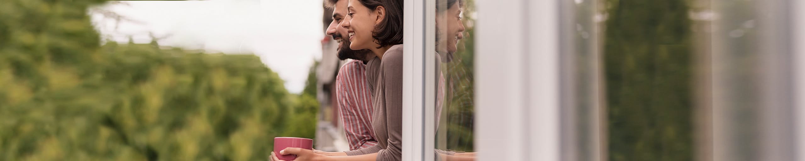 Couple looking out of window