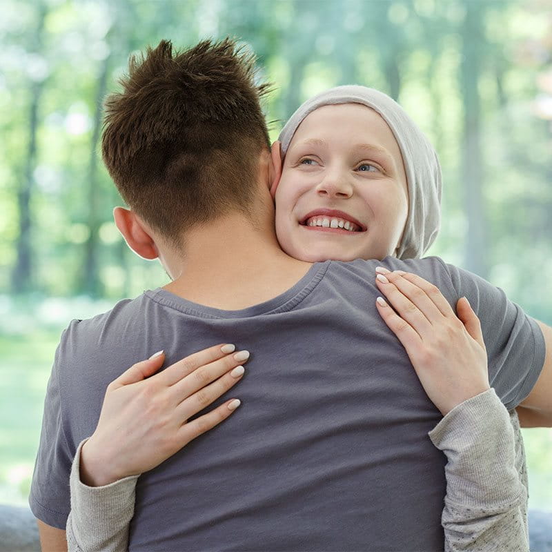 A man hugging a girl