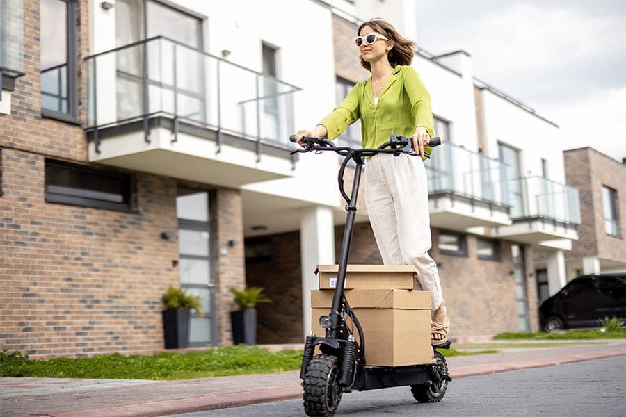 Woman rides e-scooter