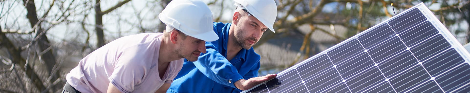 Men mount a solar panel Men mount a solar panel