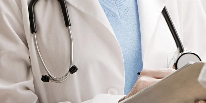 A doctor and his patient having a conversation. A doctor and his patient having a conversation.